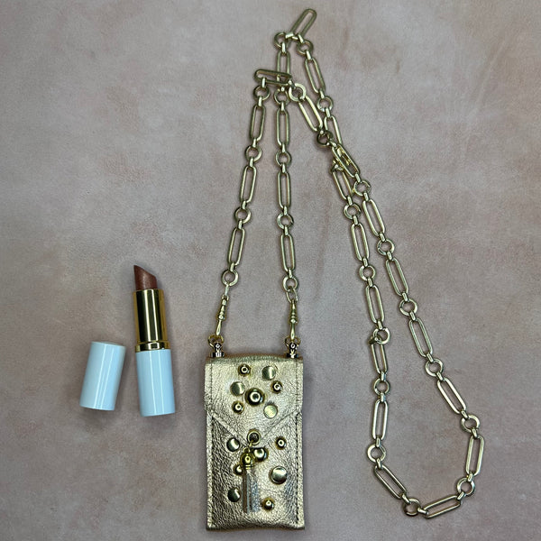 Lipstick pouch on long gold chunky chain. 