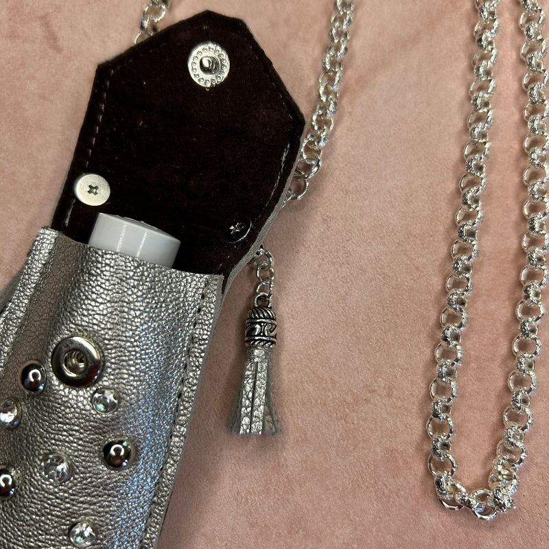 Interior view of suede lining of silver leather pouch necklace.