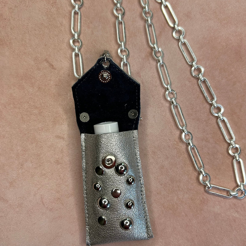 Interior view of suede lining in silver leather pouch necklace on chunky chain.