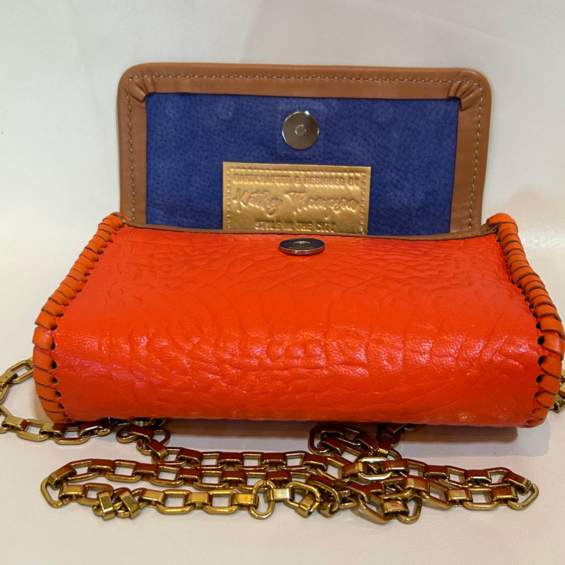 Blue suede interior of orange croc leather mini bag