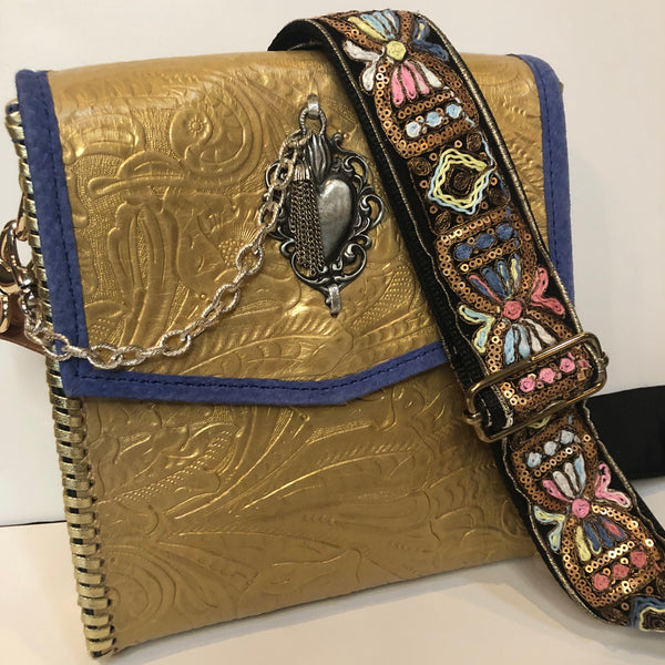 Metallic Gold leather crossbody bag with boho strap.