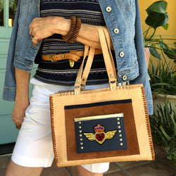 Styled View with casual outfit, carrying the Tan Croc Print Leather Tote with winged heart applique