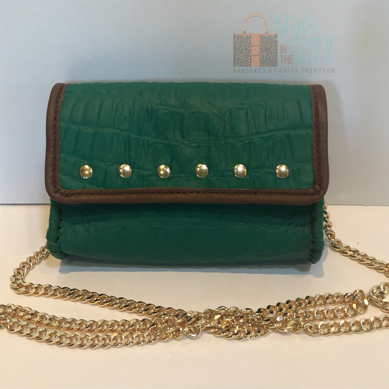 Emerald green leather mini bag, gold nailheads, brown leather trim, on long gold chain.