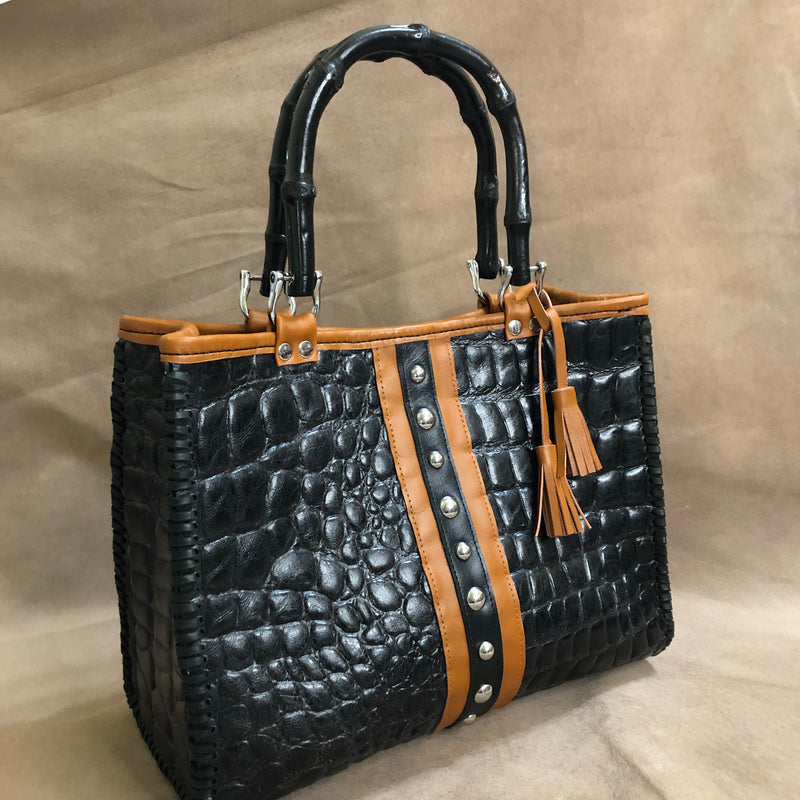 Black croc print leather tote bag with chestnut brown leather trim, silver nailheads & bamboo handles..