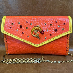 Orange croc print leather clutch with red & yellow crystal fish embellishment