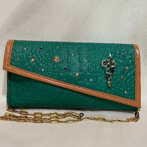 Embellished green croc print leather bag with gold chain handle.