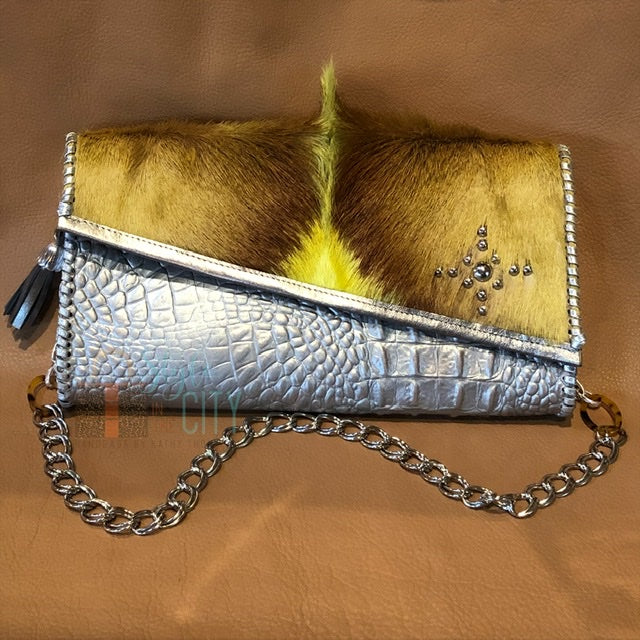 Metallic silver leather clutch with Springbok & nailhead accents.