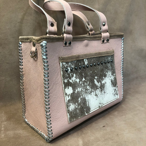 Side view of pink blush petite tote with pony print pockets & silver accents