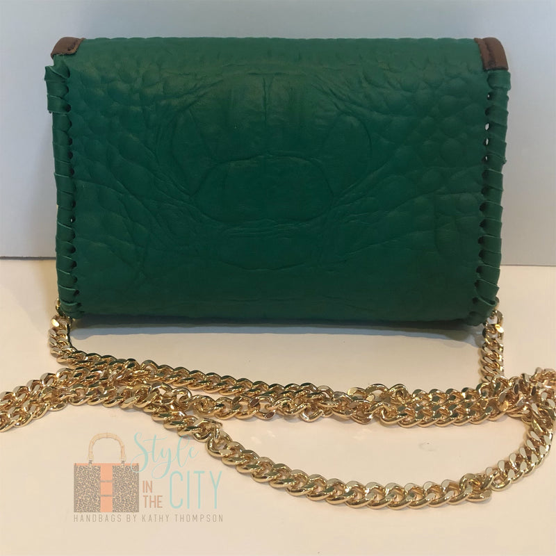 Back view of Emerald green leather mini bag on long gold chain.