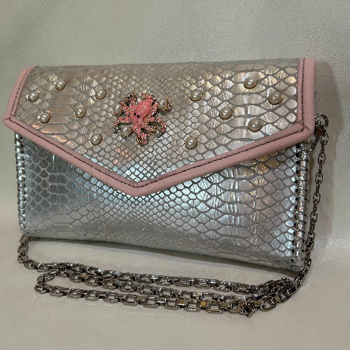 Silver snake print leather clutch with pink trim & pearl accents and silver chain handle.