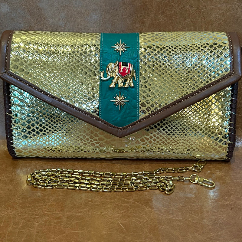 Gold chain handle with gold snake print leather envelope clutch with vintage elephant.