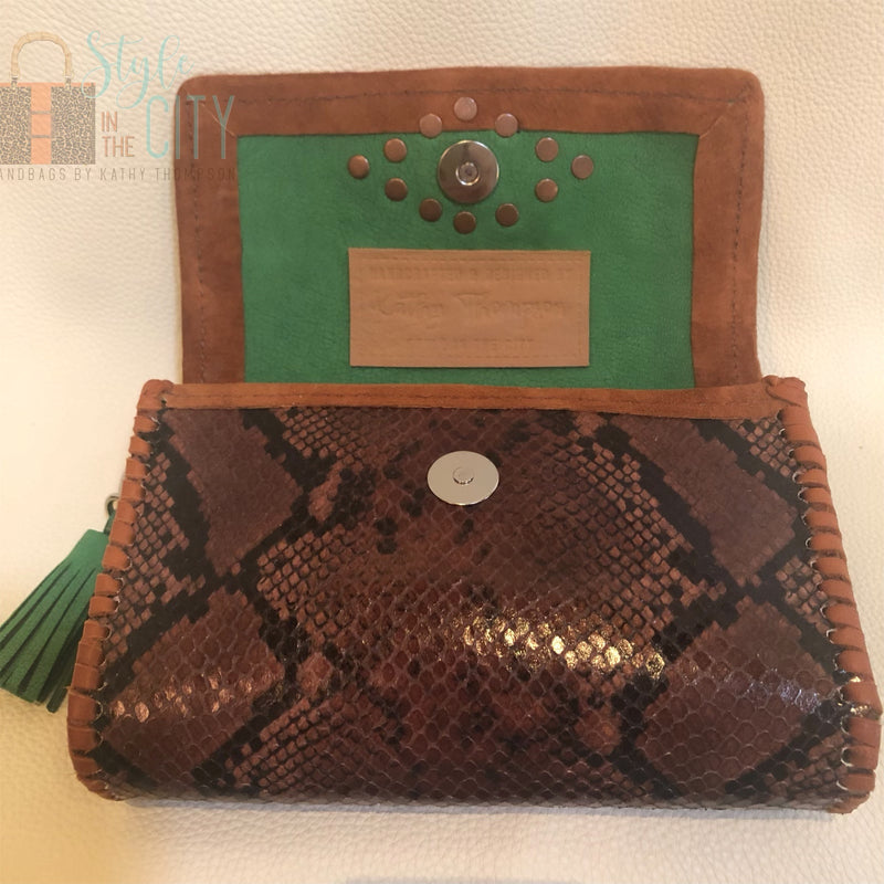 Interior green leather lining of brown snake print leather mini bag