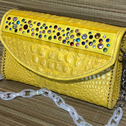 Yellow croc print leather clutch with multicolored crystals and acrylic chain handle
