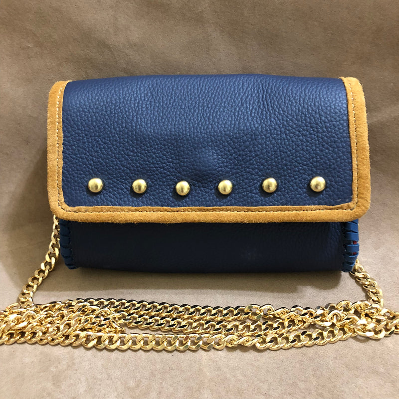 Navy & Tan leather mini bag accented with domed studs & long gold chain.