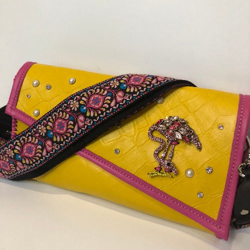 Yellow croc print leather bejeweled clutch bag with optional wide add on strap in pink 